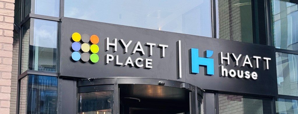 The Hyatt Place and Hyatt House dual-branded sign at the building's entrance.