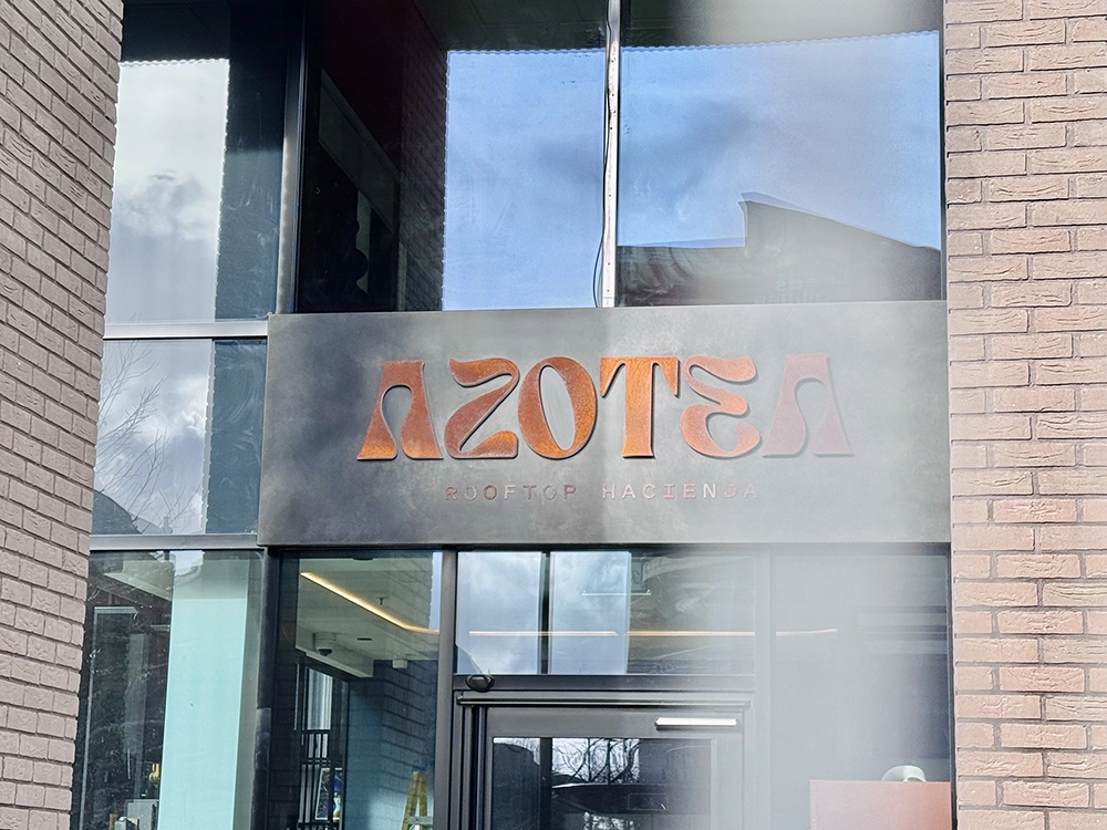 A close-up of the Azotea bar sign by the entrance.