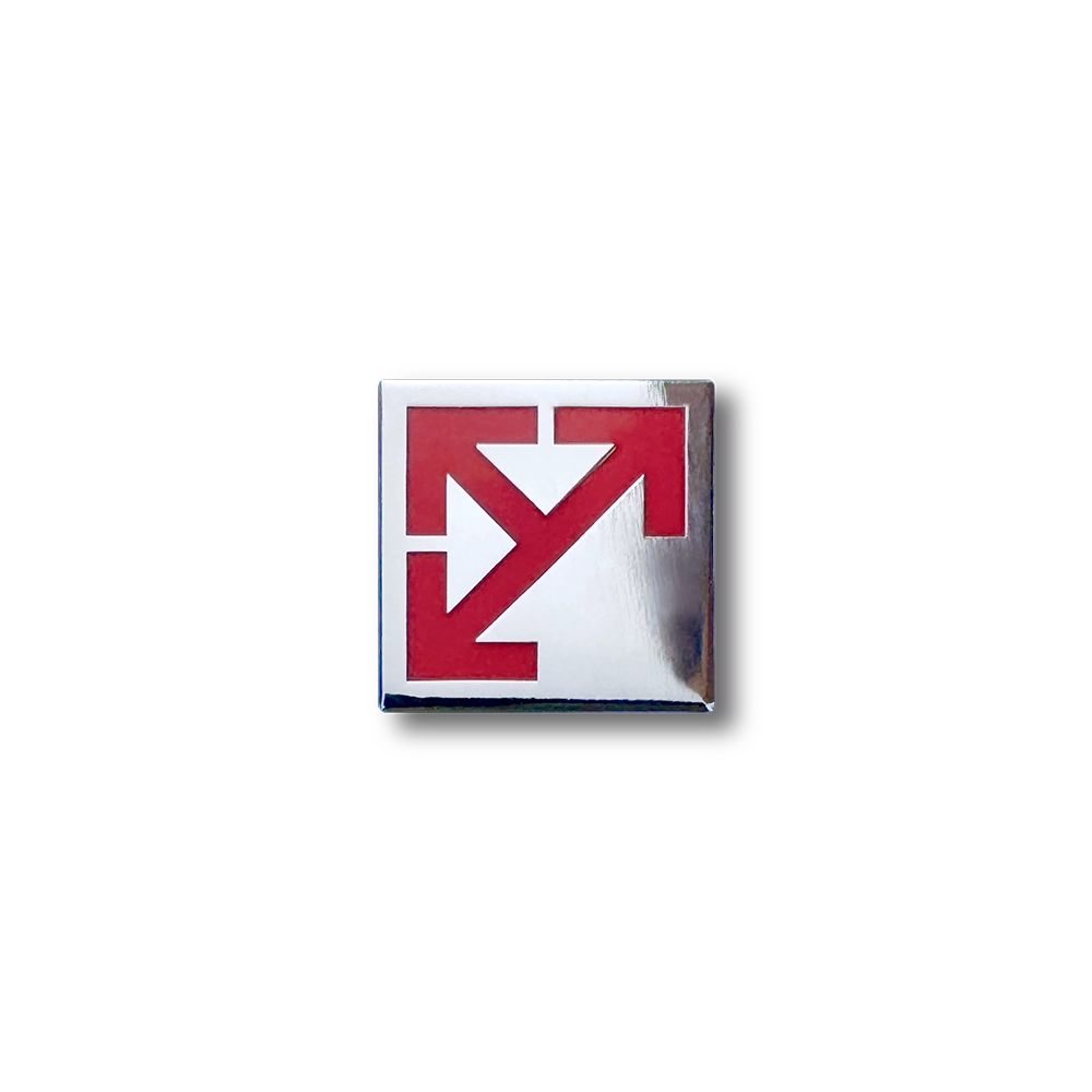 Leeds Motorway City badge with the arrow emblem in red on a polished silver background.