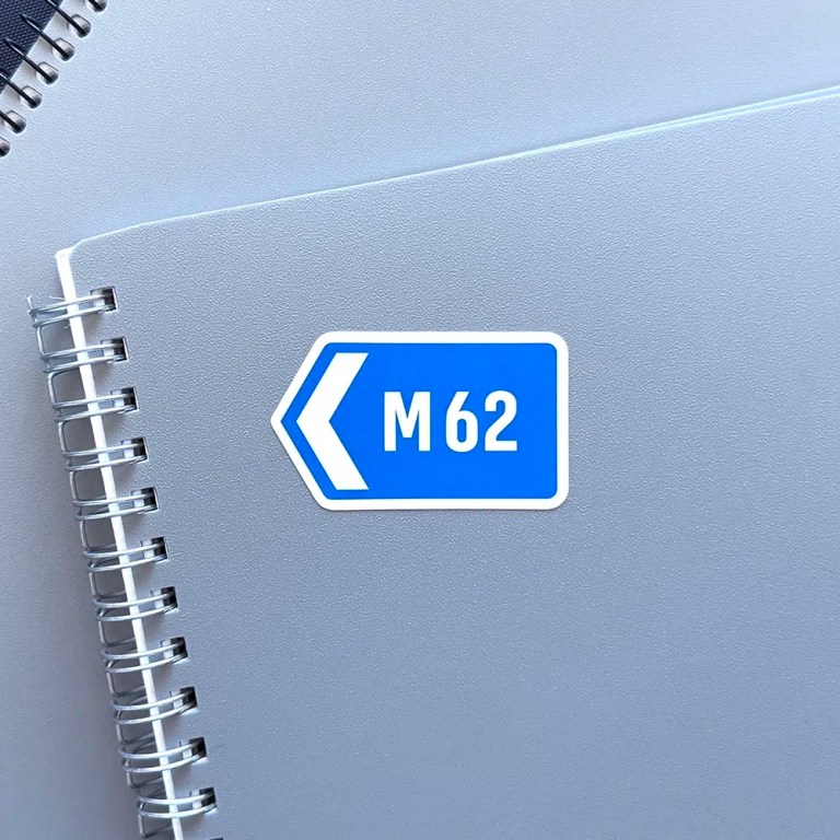 M62 sticker on a notebook facing right.
