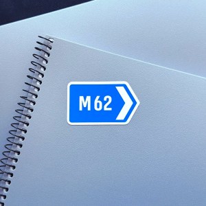 M62 sticker on a notebook facing right.