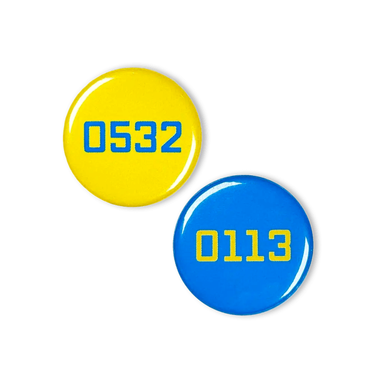 Two Leeds dialling code button badges: 0113 in yellow on a blue background and 0532 in blue on a yellow background.