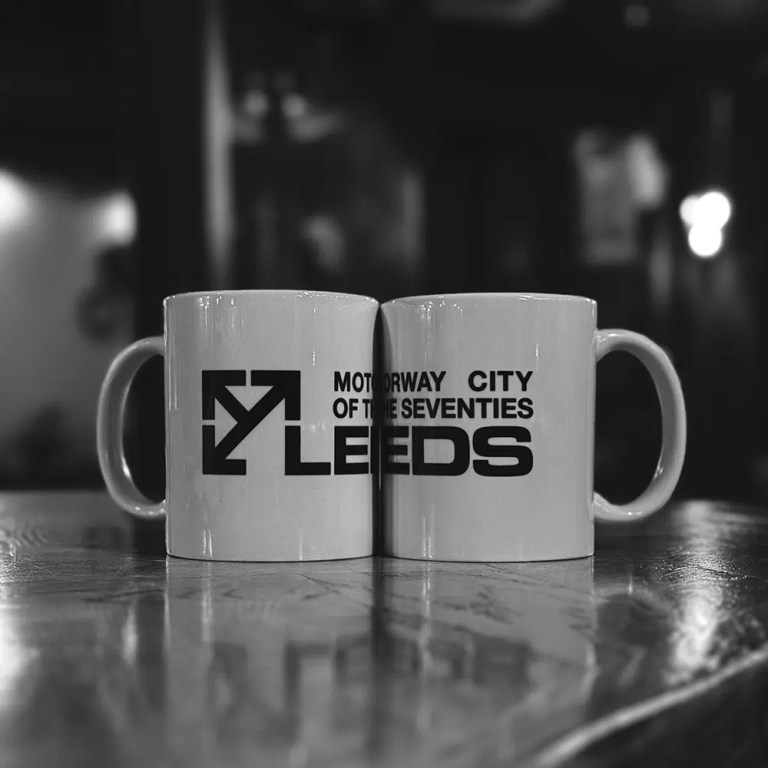 Leeds Motorway City of the Seventies white mug with black print.