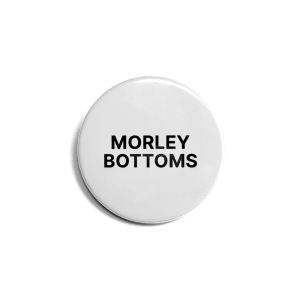 White button badge with 'Morley Bottoms' in black text.