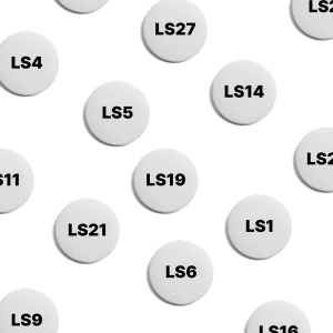 Assortment of LS postcode button badges.